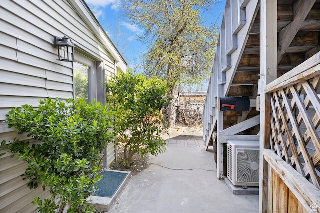 view of patio featuring cooling unit and fence
