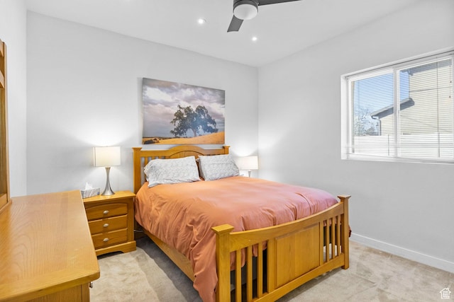 bedroom featuring recessed lighting, light colored carpet, baseboards, and ceiling fan