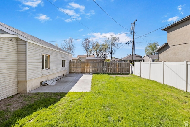 view of yard featuring a patio area and a fenced backyard