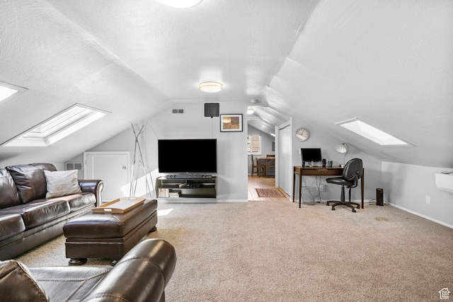 living area featuring carpet floors, baseboards, lofted ceiling with skylight, and visible vents