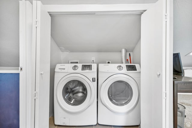 laundry area with separate washer and dryer and laundry area