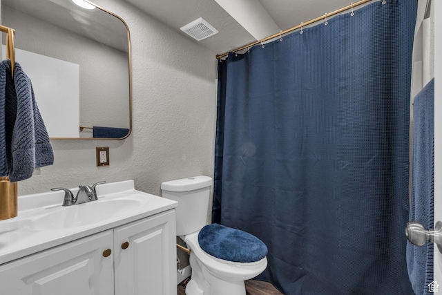 3618 S 300 E Unit A, Salt Lake City, UT 84115 - full bathroom with a textured wall, toilet, vanity, and a shower with shower curtain
