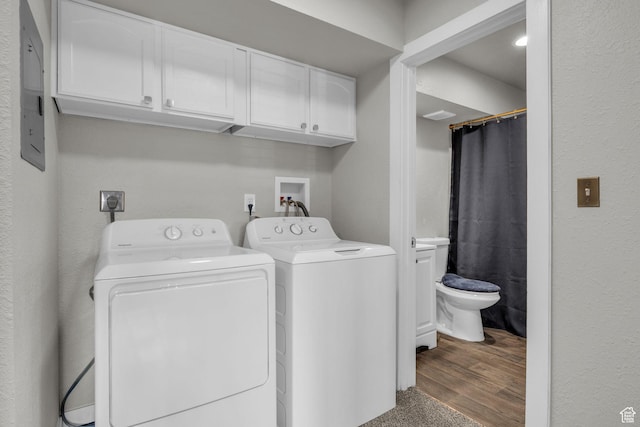 3618 S 300 E Unit A, Salt Lake City, UT 84115 - laundry room with washer and dryer, cabinet space, and wood finished floors