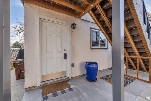 3618 S 300 E Unit A, Salt Lake City, UT 84115 - view of exterior entry with stucco siding and a patio area