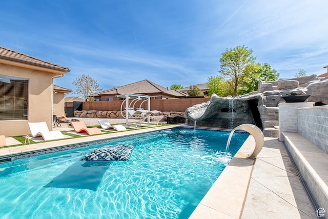 view of swimming pool with a fenced in pool, a patio, and a fenced backyard