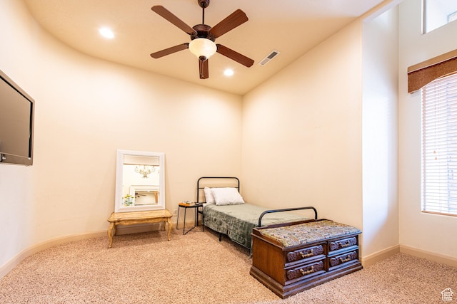 carpeted bedroom featuring high vaulted ceiling, visible vents, and multiple windows