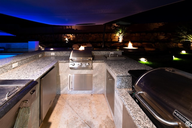 view of patio with a grill and area for grilling
