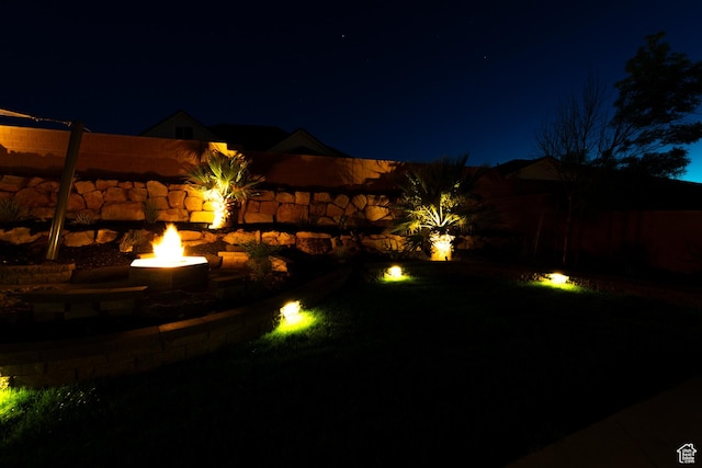 view of yard at twilight