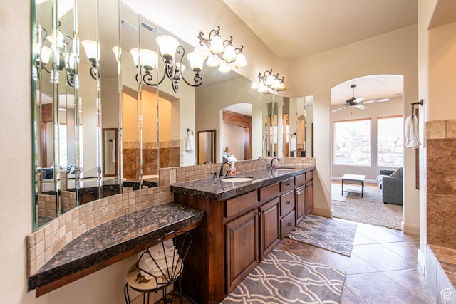 full bath featuring tile patterned flooring, double vanity, a sink, and ceiling fan