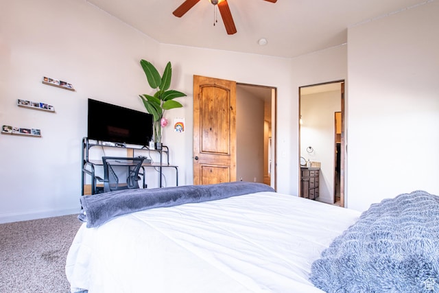 carpeted bedroom featuring baseboards