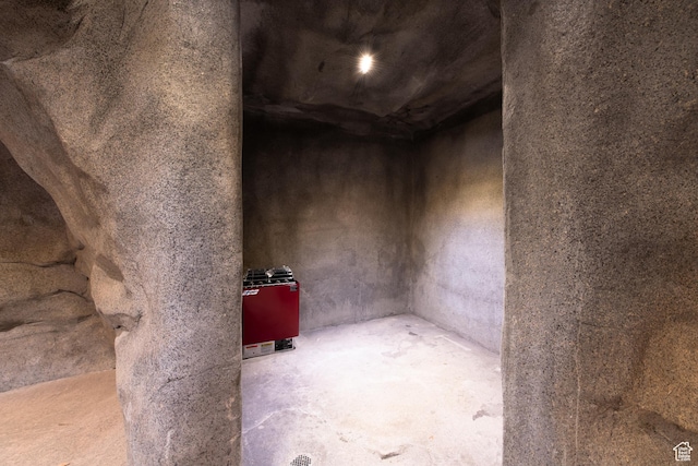 misc room with unfinished concrete flooring