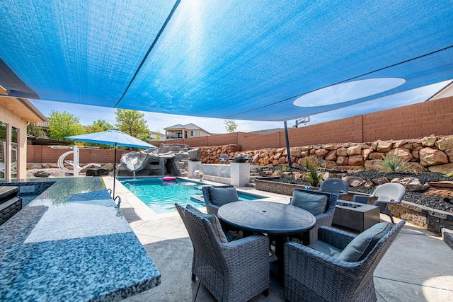 view of swimming pool with a patio, a fenced backyard, and a fenced in pool