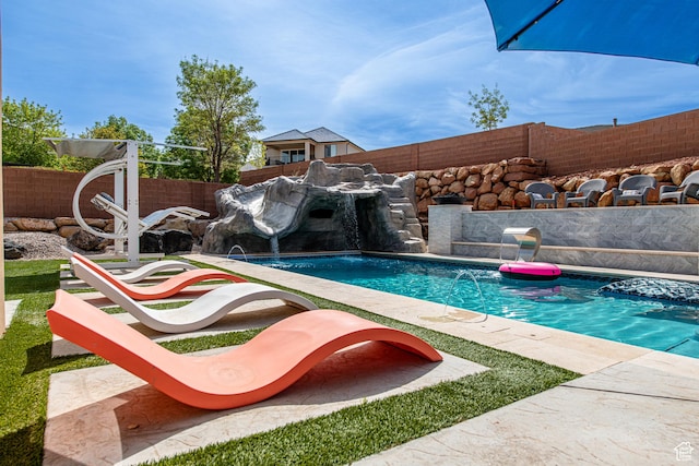 view of pool featuring a fenced in pool and a fenced backyard