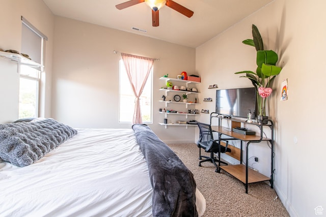 bedroom featuring carpet flooring, visible vents, baseboards, and ceiling fan