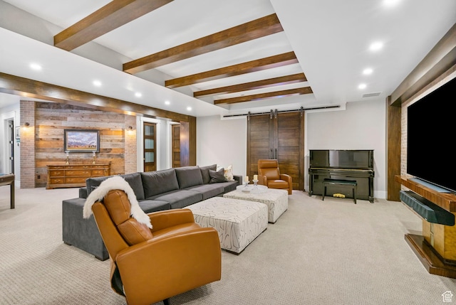 living area with wood walls, recessed lighting, a barn door, and carpet floors