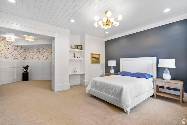 bedroom with carpet, recessed lighting, and a chandelier