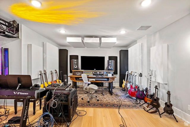 interior space featuring wood finished floors, baseboards, visible vents, and recessed lighting