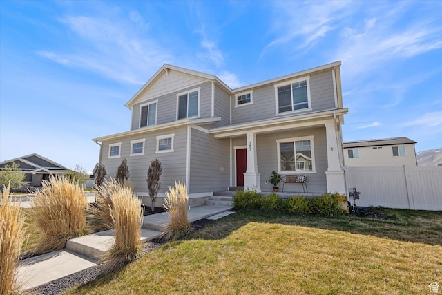 283 E Echo Ledge Dr S, Saratoga Springs, UT 84045 - traditional-style home featuring a porch, a front yard, and fence