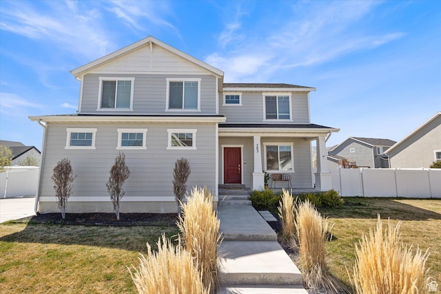 283 E Echo Ledge Dr S, Saratoga Springs, UT 84045 - view of front of house with a porch, fence, and a front lawn