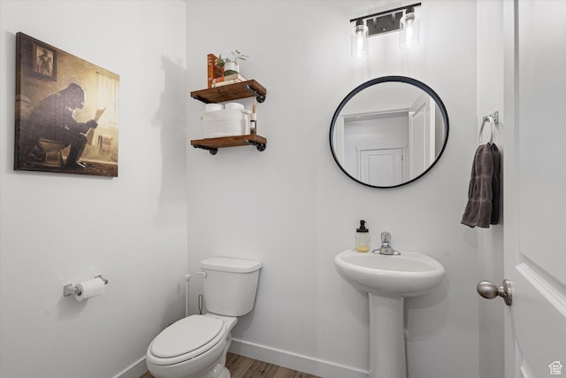 283 E Echo Ledge Dr S, Saratoga Springs, UT 84045 - half bathroom featuring toilet, wood finished floors, and baseboards