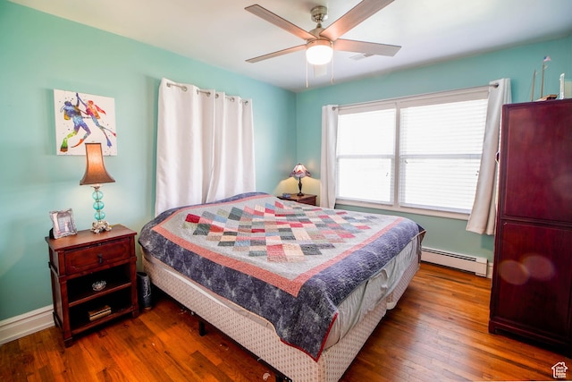 bedroom with baseboard heating, a ceiling fan, and wood finished floors