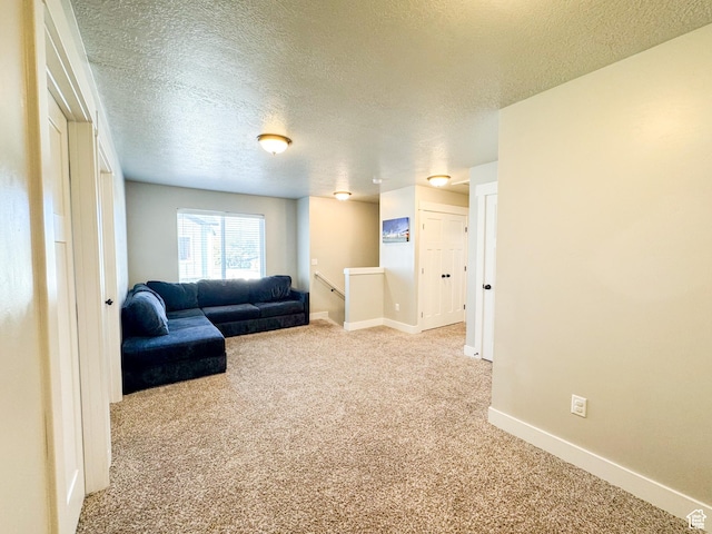 847 E 275 N Unit 847, Hyrum, UT 84319 - carpeted living area with a textured ceiling and baseboards