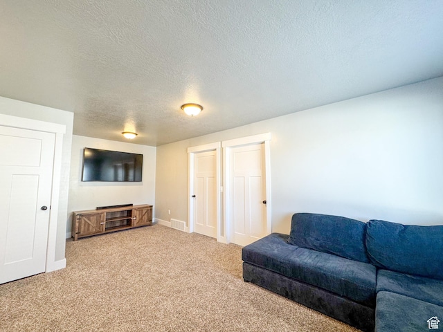 847 E 275 N Unit 847, Hyrum, UT 84319 - carpeted living room featuring visible vents, a textured ceiling, and baseboards