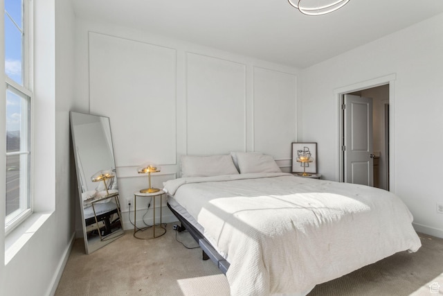 bedroom with baseboards and carpet flooring