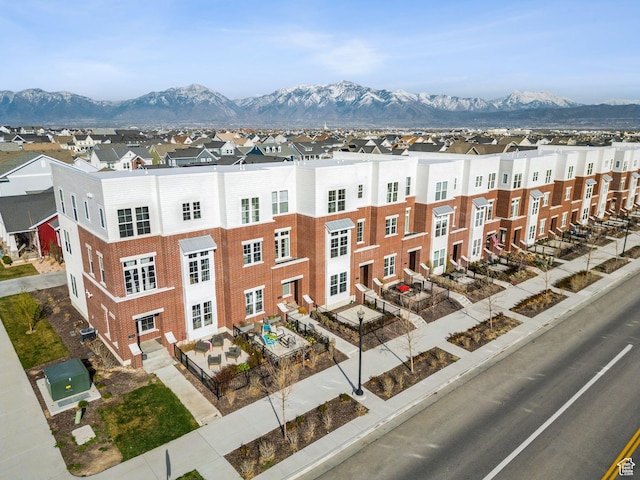 view of property featuring a mountain view and a residential view
