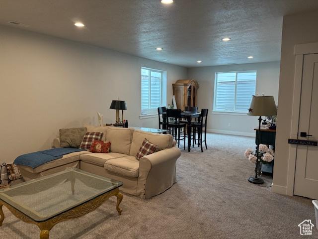 328 E 1100 S, Centerville, UT 84014 - carpeted living room featuring baseboards, recessed lighting, and a textured ceiling