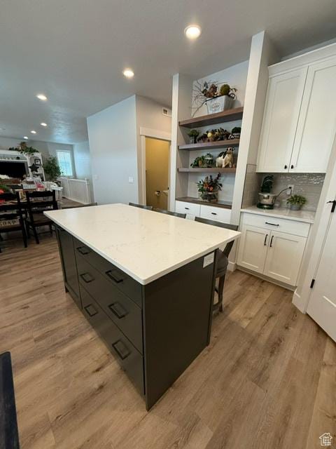 328 E 1100 S, Centerville, UT 84014 - kitchen featuring light wood-type flooring, recessed lighting, white cabinetry, open shelves, and a kitchen island