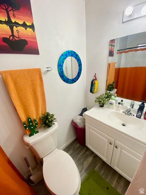331 N 400 E, Logan, UT 84321 - full bath with vanity, baseboards, toilet, and wood finished floors
