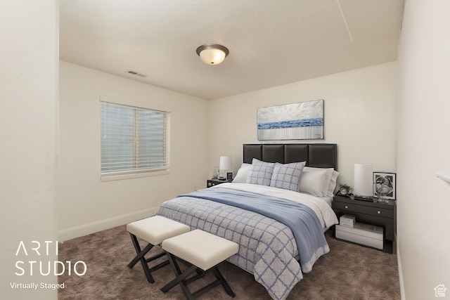 carpeted bedroom featuring visible vents and baseboards