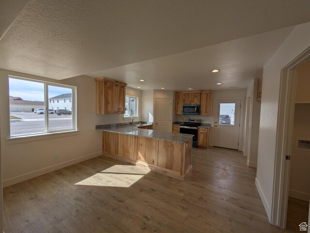 340 N 2650 W Unit 16, Tremonton, UT 84337 - kitchen featuring stainless steel electric range, a sink, and plenty of natural light