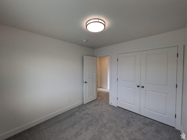 340 N 2650 W Unit 16, Tremonton, UT 84337 - unfurnished bedroom featuring a closet, baseboards, and carpet