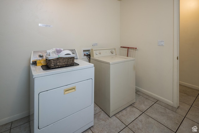 327 W Williams Way, Moab, UT 84532 - laundry room with baseboards, laundry area, light tile patterned flooring, and independent washer and dryer