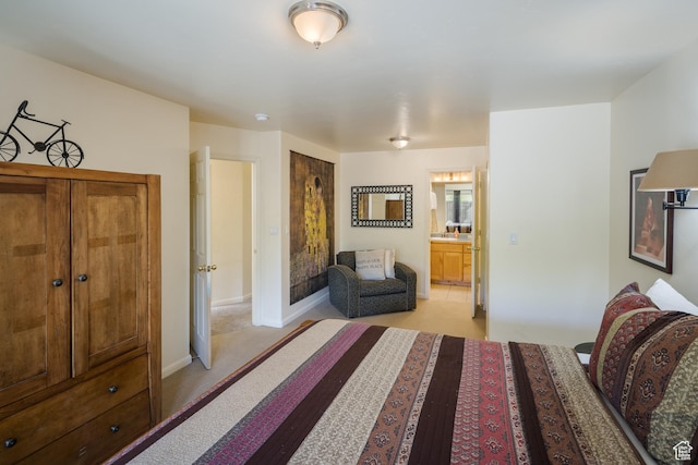 327 W Williams Way, Moab, UT 84532 - bedroom with connected bathroom, baseboards, and light colored carpet