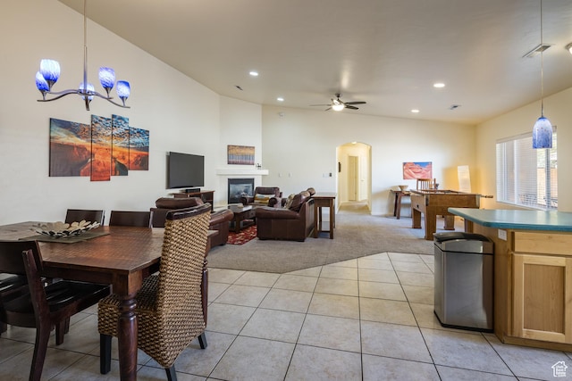 327 W Williams Way, Moab, UT 84532 - dining space featuring light tile patterned floors, arched walkways, recessed lighting, and light colored carpet