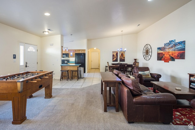 327 W Williams Way, Moab, UT 84532 - interior space featuring arched walkways, light tile patterned floors, an inviting chandelier, light carpet, and recessed lighting