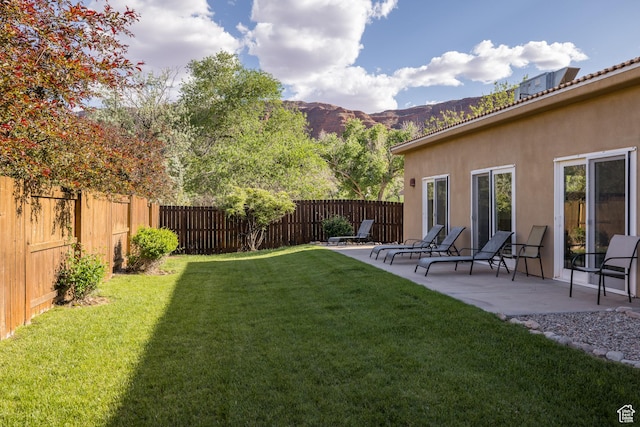 327 W Williams Way, Moab, UT 84532 - view of yard with a mountain view, a fenced backyard, and a patio area