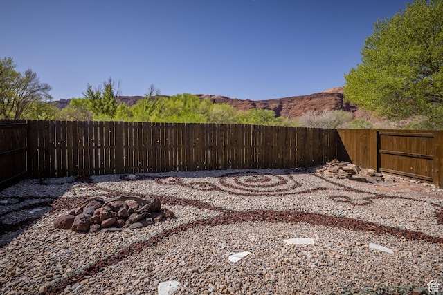 327 W Williams Way, Moab, UT 84532 - view of yard featuring a fenced backyard and an outdoor fire pit