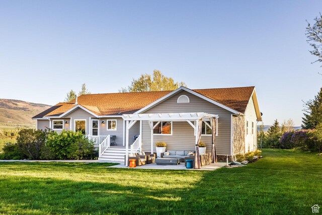 528 W Weber Canyon Rd, Oakley, UT 84055 - back of property with a pergola, outdoor lounge area, a yard, and a deck