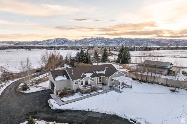 528 W Weber Canyon Rd, Oakley, UT 84055 - snowy aerial view with a mountain view