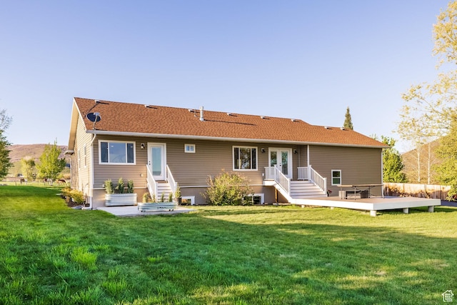 528 W Weber Canyon Rd, Oakley, UT 84055 - rear view of house with a wooden deck and a yard