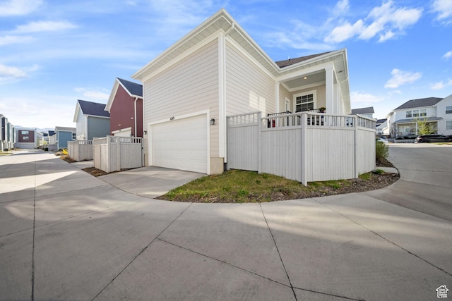 6149 W Moon Valley Dr S, South Jordan, UT 84009 - view of property exterior featuring fence, a residential view, and driveway