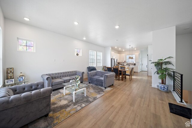 6149 W Moon Valley Dr S, South Jordan, UT 84009 - living room featuring light wood-type flooring, baseboards, and recessed lighting
