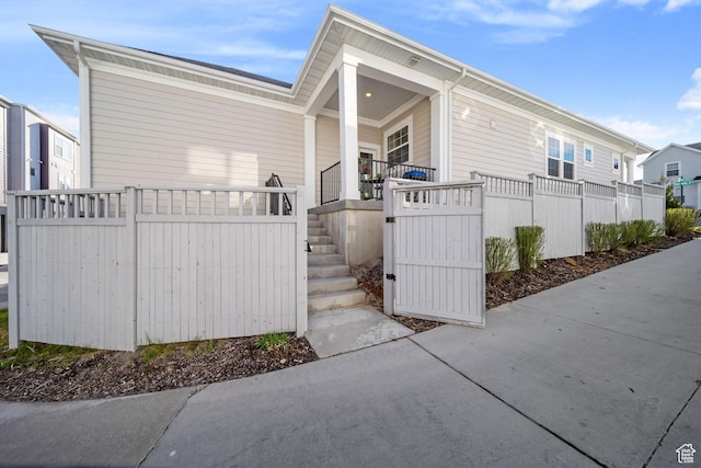 6149 W Moon Valley Dr S, South Jordan, UT 84009 - view of side of home with a porch and fence
