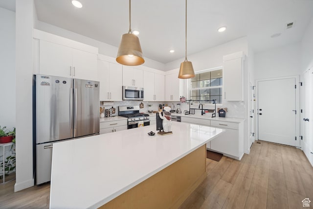 6149 W Moon Valley Dr S, South Jordan, UT 84009 - kitchen featuring tasteful backsplash, visible vents, appliances with stainless steel finishes, and white cabinetry