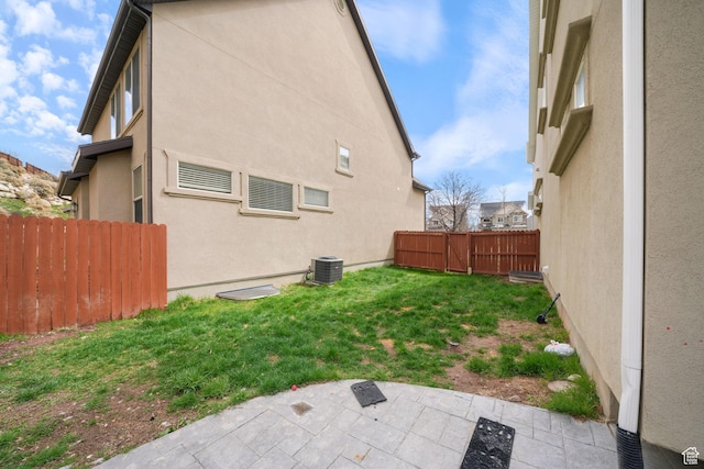 exterior space with a yard, a patio area, stucco siding, and fence