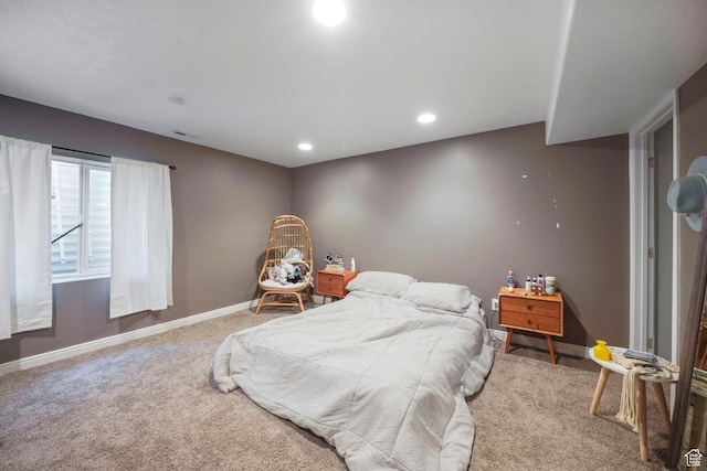 bedroom with recessed lighting, baseboards, and carpet floors